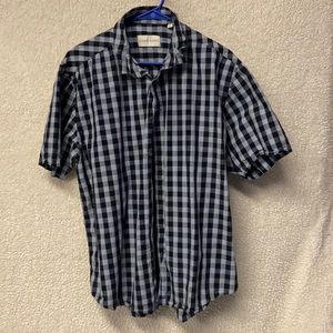 Men’s plaid button up shirt.